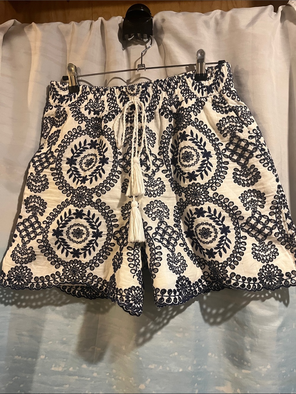 High-Waist White Shorts with Navy Embroidered Medallion Detail